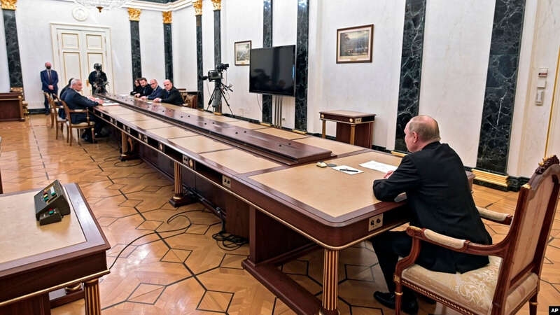 Russian President Vladimir Putin, right, leads a meeting on on economic issues in Moscow