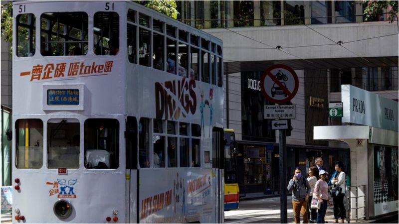 A tram travels through the Central district in Hong Kong